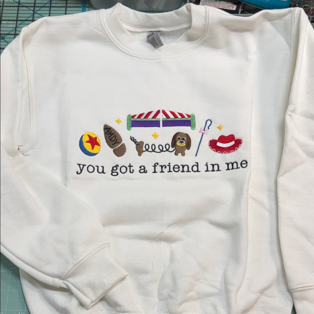 Gildan White Crewneck Sweater with Colorful Toy-Inspired Embroidery